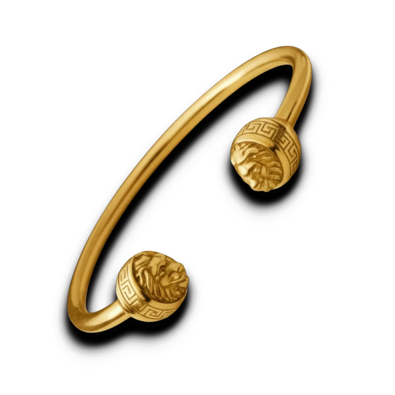 Amaranthus Gold 18k gold plated titanium cuff bracelet with lion heads at each end. Water and sweat resistant.